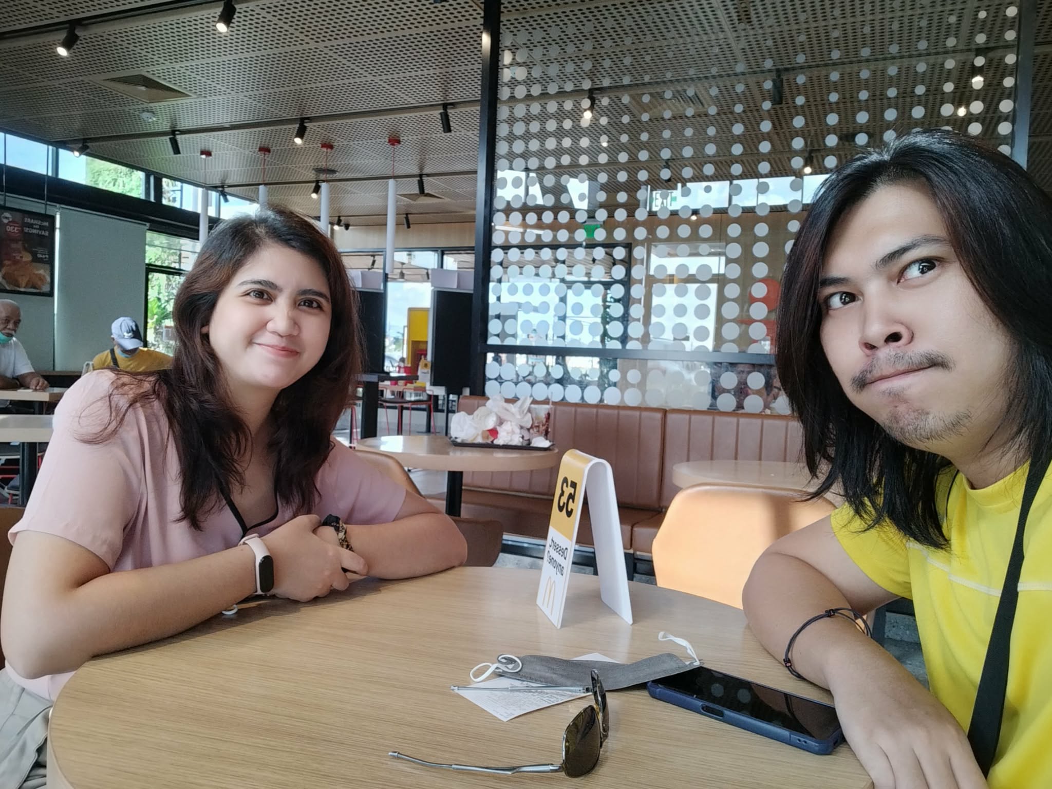 Gerald making a face with Edin at a fast food restaurant