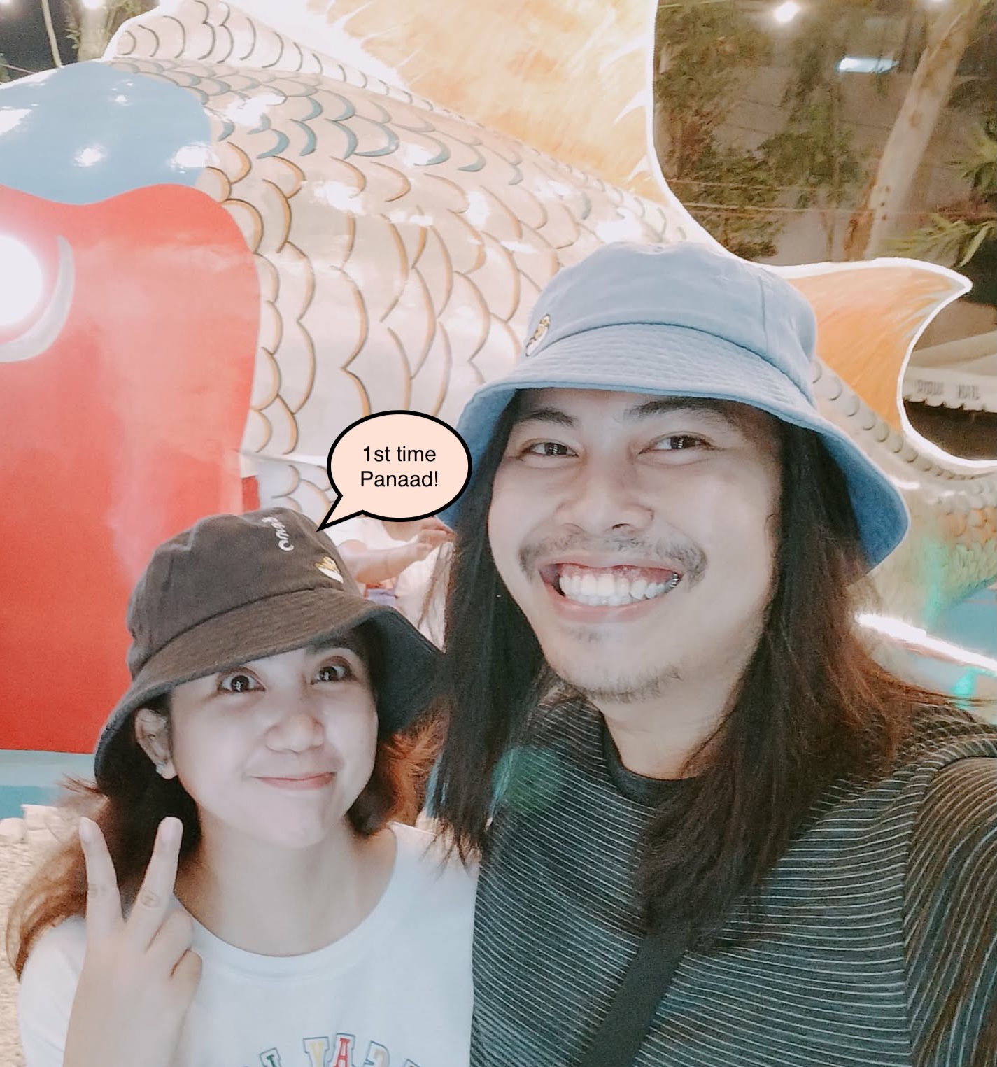 Gerald and Edin in bucket hats at Panaad park at night